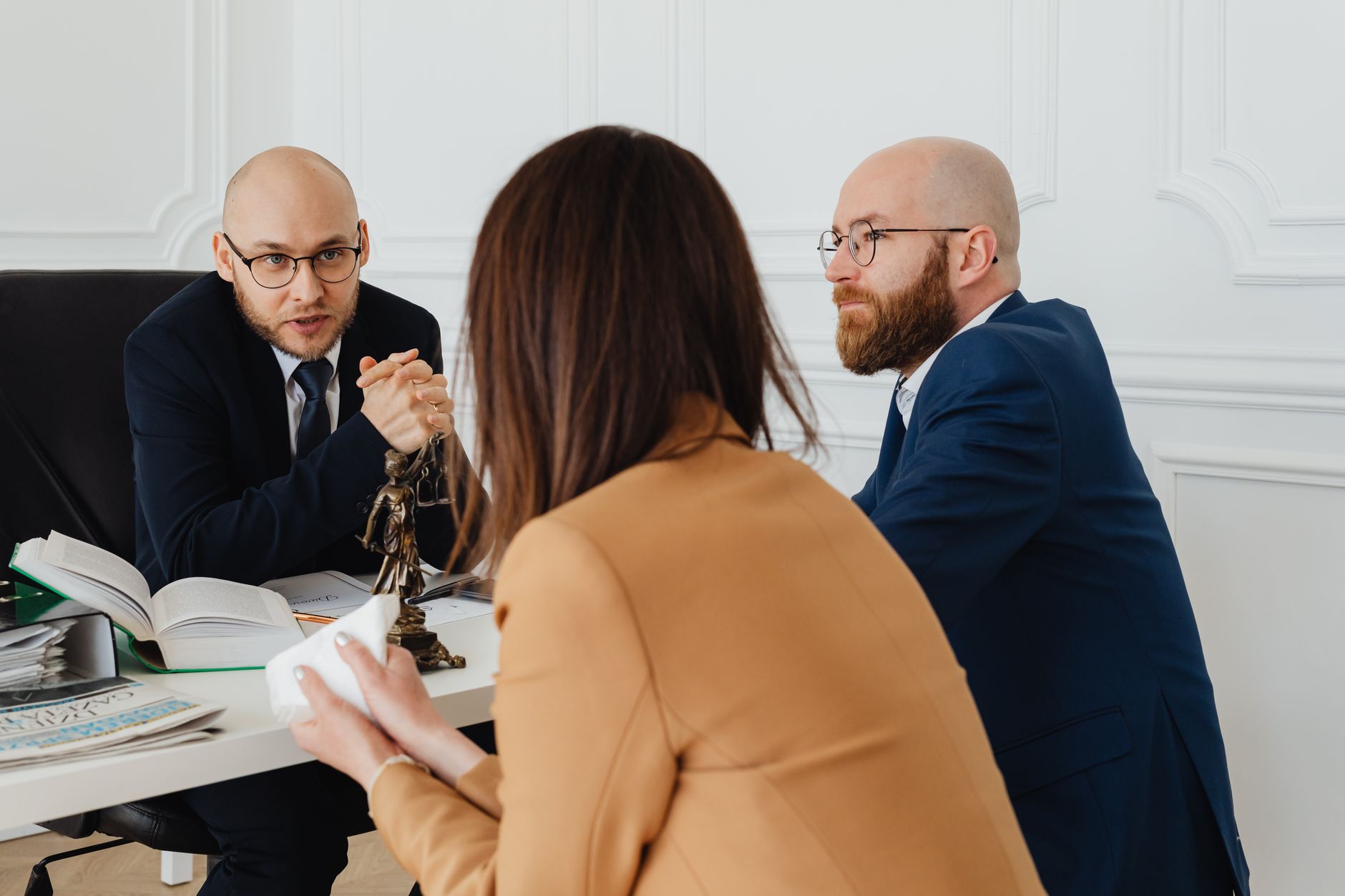 Professional discussion among lawyers in a modern office, focusing on legal matters. — A Short Help guide to Property Law
