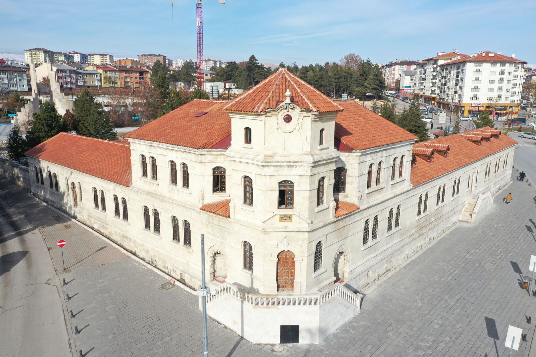 Aerial view of a historic stone building with red tile roofs in Sivas, Turkey, on a sunny day. — Baji999 Cricket: What to Kno