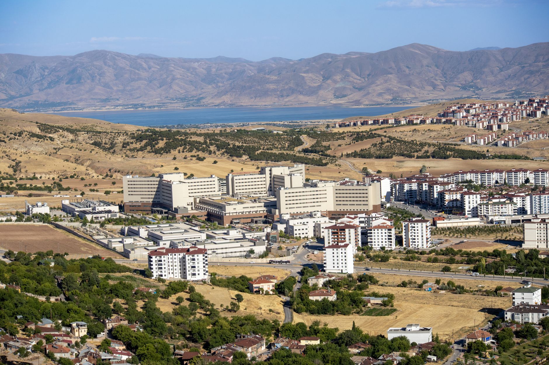 Stunning aerial photograph capturing the expansive cityscape of Elâzığ, Türkiye, with distant mountains. — Benefits of Cross-