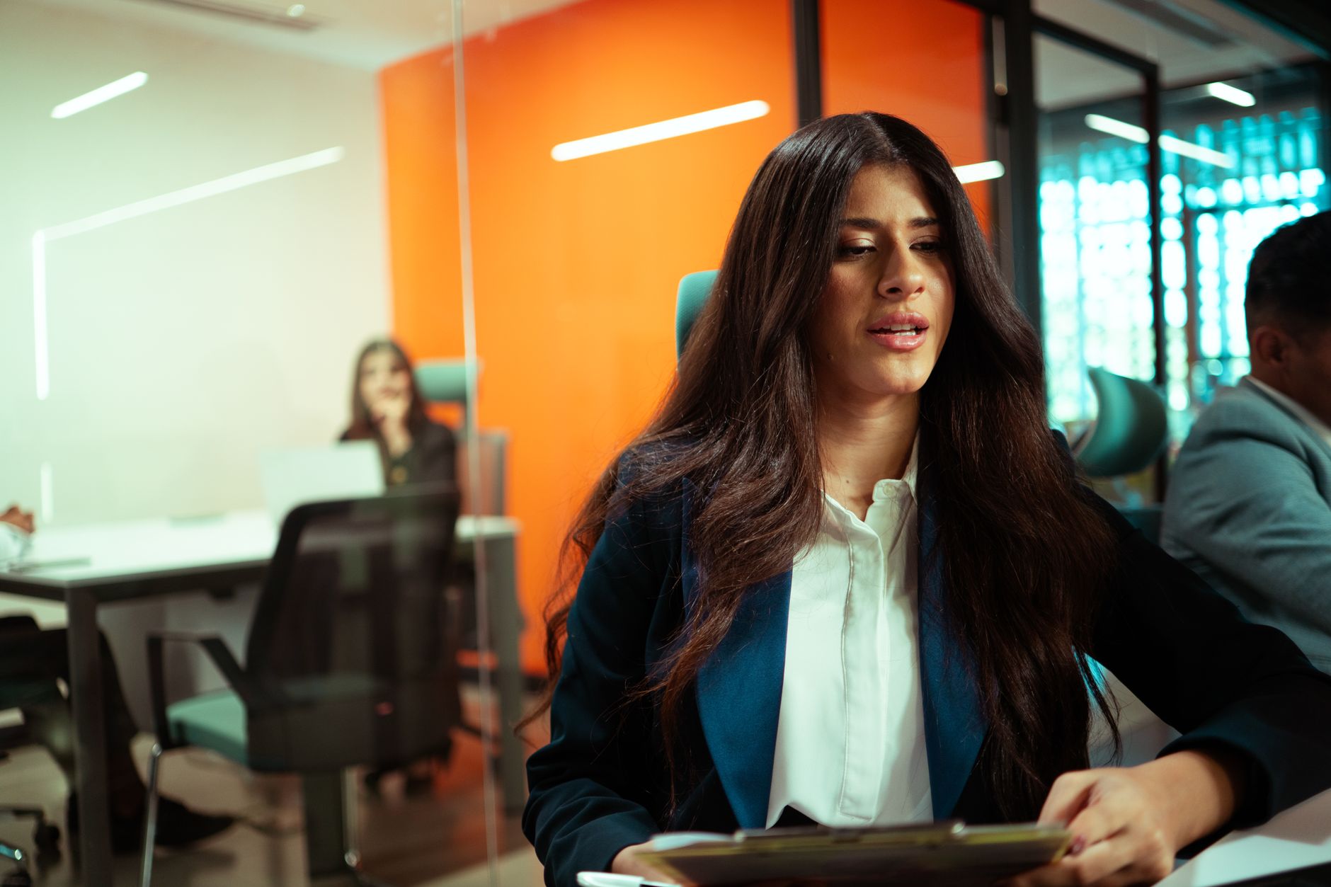 Two business professionals in a modern office setting during a team meeting. — Five Distinct Mindsets of the Entrepreneur