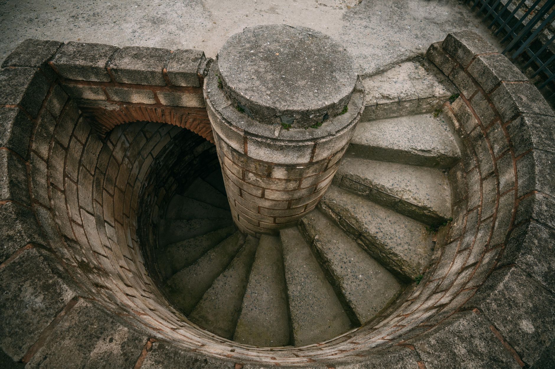 Top view of a spiraling stone staircase outdoors, showcasing architectural beauty. — Making Sure Your PG Slot Applica
