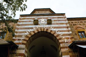 Entrance of the historic Kurşunlu Han in Manisa, Türkiye featuring traditional Ottoman architecture. — W88 Casino: A