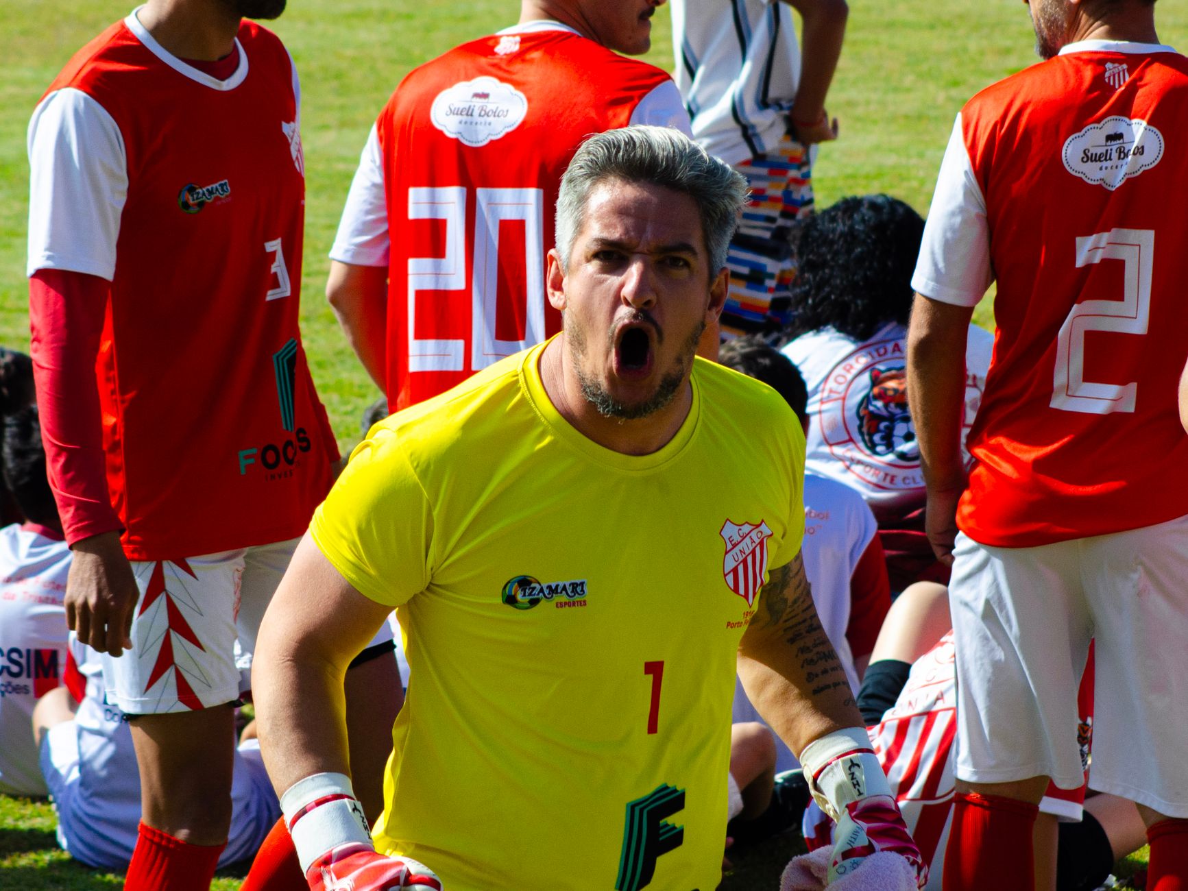 Goalkeeper in action with team during a competitive soccer match outdoors. — Unionrayo Creates Meaningful Moments for Members